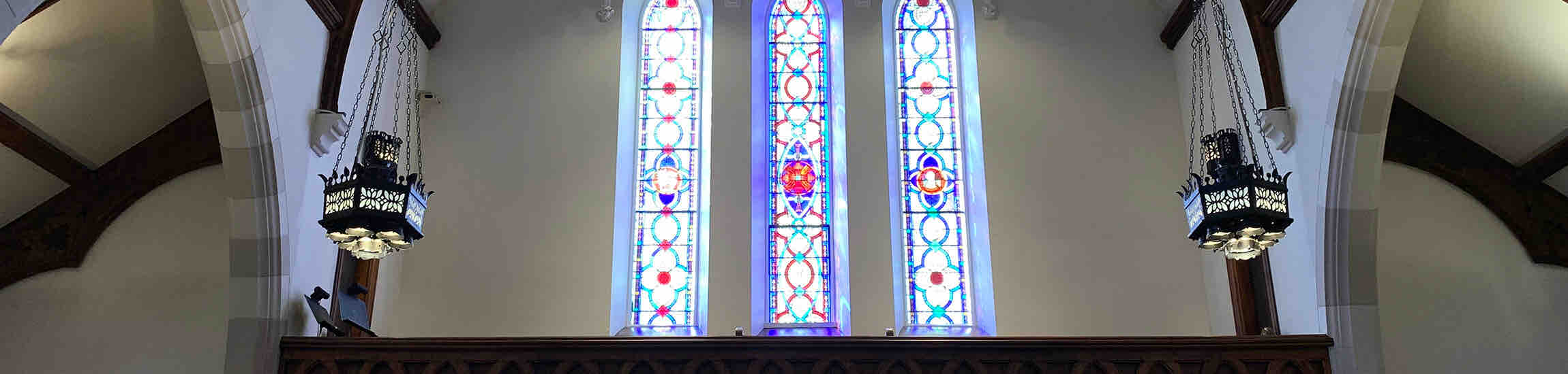 Sanctuary balcony and west stained glass windows