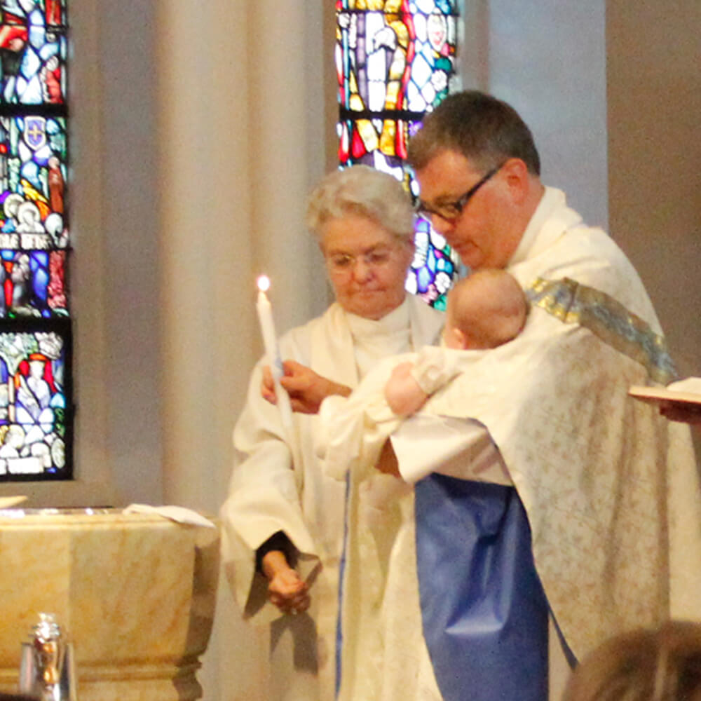 An infant being baptized