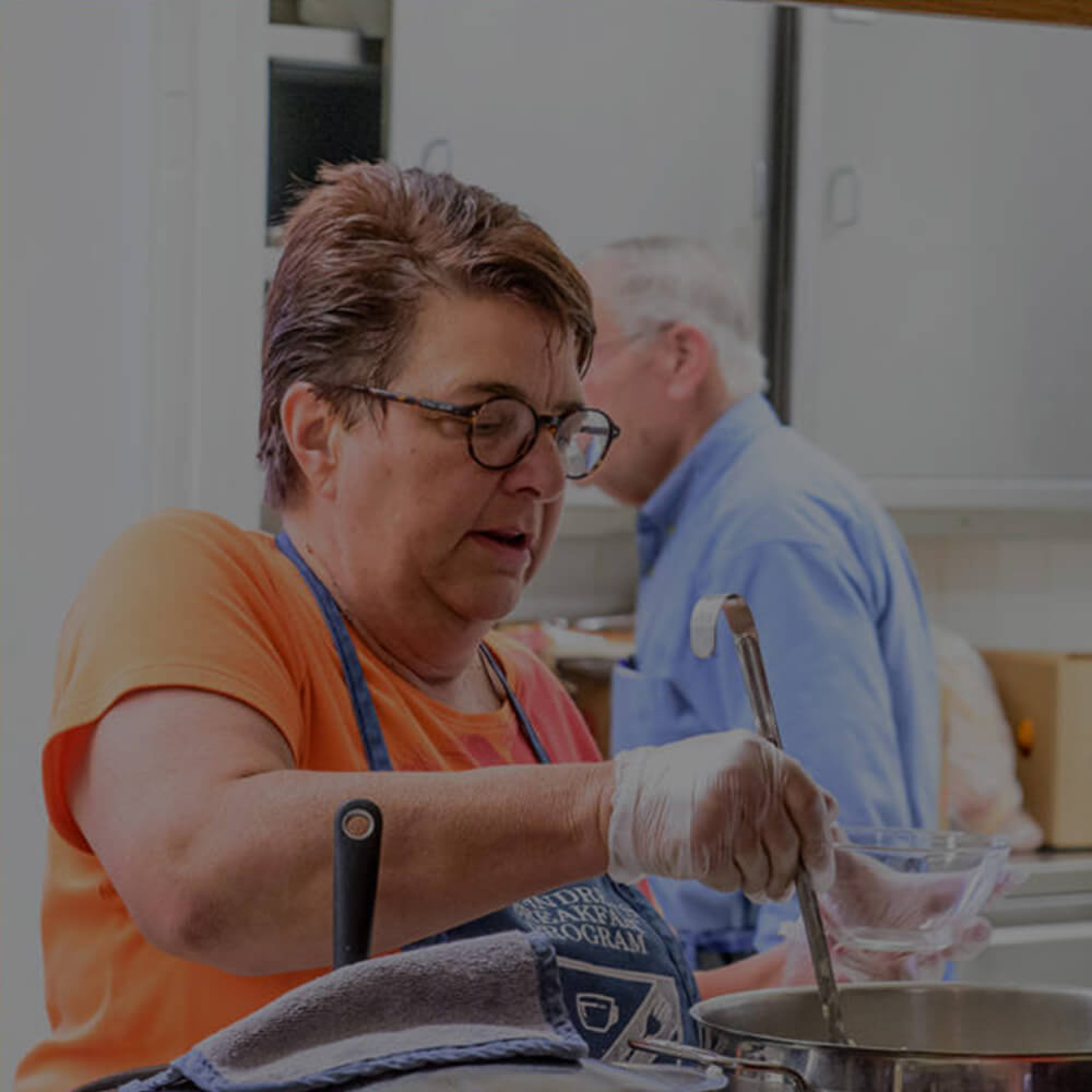 Volunteer serving food