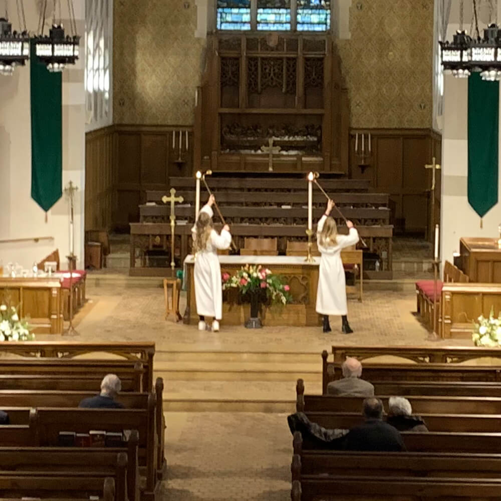 Acolytes lighting candles